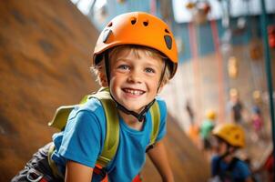 a young boy is smiling while wearing an orange helmet photo