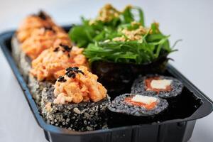 Close-up of sushi rolls made Sushi-food hybrids trend. photo