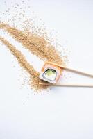 Sushi delivery. Set of rolls in a disposable box on a black background. Top view photo