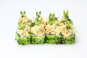Sushi delivery. Set of rolls in a disposable box on a black background. Top view photo