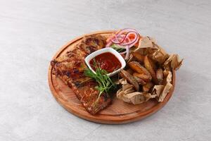 Grilled pork ribs with BBQ sauce photo