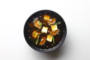 Asian soup in a cup isolated on white background. photo