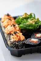 Close-up of sushi rolls made Sushi-food hybrids trend. photo