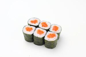 Sushi delivery. Set of rolls in a disposable box on a black background. Top view photo