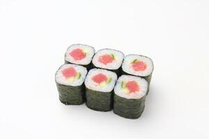 Sushi delivery. Set of rolls in a disposable box on a black background. Top view photo