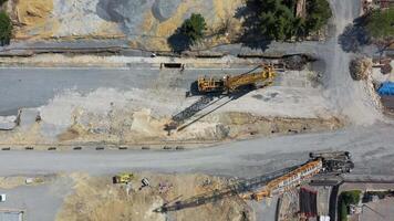 installation of diaphragm wall bars and huge crawler cranes at metro station construction site video