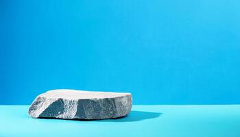 Grey stone podium style luxury on blue background with natural light soft shadow photo