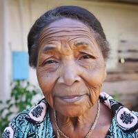 An African old lady with face sad expression photo