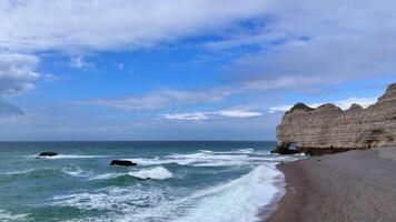 Etretat Porte d'Aval France Normandy Cliffs of Etretat Atlantic natural arche 4k video