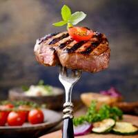 grilled Bavarian steak on a fork photo