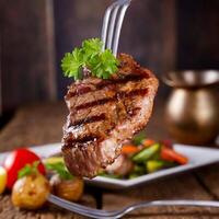 grilled Bavarian steak on a fork photo