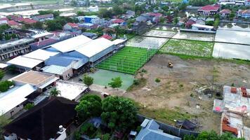 Aerial view of mini football match, soccer. MiniFootball field and Footballers from drone video