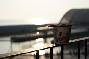 Sunrise Splendor, CloseUp Instant Noodle Bokeh with Taiwan Sky and Ocean Beauty photo