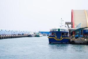 Coastal Maritime View, Pier, Jetty Harbouring Ferry Ships in Taiwan Kaohshiung photo