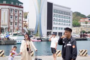 Taiwan Island Escapade, Harbour Front Hotels, Buildings, and Incoming Tourists photo