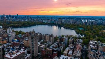 Scenic view of Central Park in the cityscape of New York, the USA. Aerial perspective. Enormous city panorama at sunset. photo