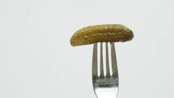 a close up of a pickle on a plate with tomatoes video