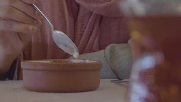 woman eating rice pistachios pudding , video