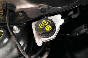 Brake fluid reservoir in a car , Automotive part concept photo