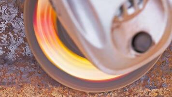 rusted metal surface is being cleaned with angle grinder and a flap disc, full-frame closeup video