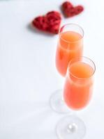 Two bellini cocktails with hearts photo