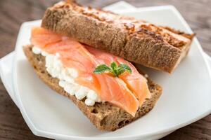 Sandwich with salmon and cheese photo