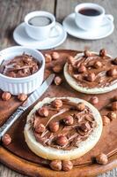 Bun slices with chocolate cream and nuts photo