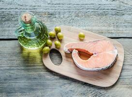 Food with unsaturated fats - salmon and olive oil photo