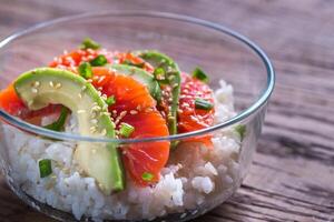 White rice with salmon and avocado photo