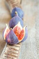 Ripe figs cross section and whole fruits photo