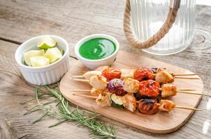 Grilled chicken skewers with zucchini and cherry tomatoes photo