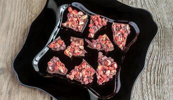 Luxury chocolate bar with dried berries photo