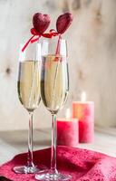 Glasses of champagne in candlelit on St Valentine's day photo