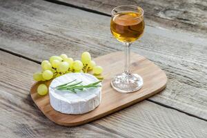 Camembert with walnuts and grape photo
