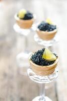 Sandwiches with black caviar photo
