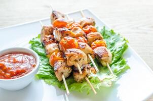 Grilled chicken skewers with cherry tomatoes photo