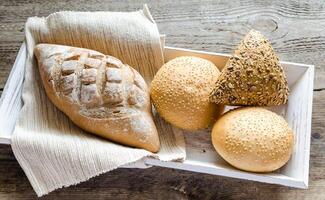 Whole wheat bread with sesame and flax-seed buns photo