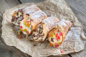 Cannoli stuffed with cream cheese photo