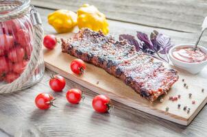 Grilled pork ribs in barbecue sauce photo