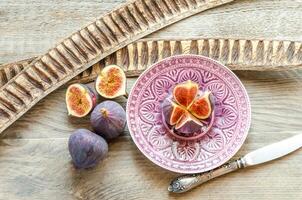 Ripe figs cross section and whole fruits photo