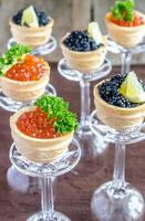 Sandwiches with black and red caviar photo