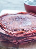 Red velvet crepes with whipped cream photo