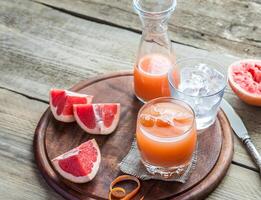 Grapefruit fresh on the wooden table photo