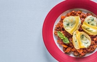 Lumaconi stuffed with ricotta with bolognese sauce photo