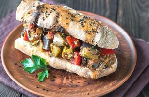 Sandwich with ratatouille on the plate photo