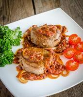 Angus Beef Steaks With Roasted Tomato Sauce photo