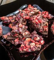 Luxury chocolate bar with dried berries photo