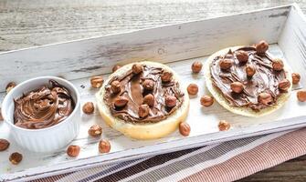 Bun slices with chocolate cream and nuts photo