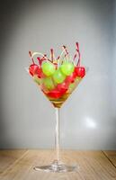 Glace cherries in martini glass photo