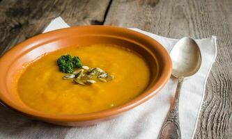 Spicy pumpkin soup with pumpkin seeds photo